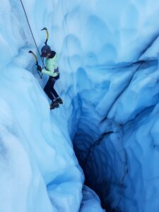 Ice climber on blue ice