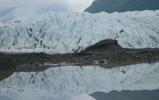 Glacier reflecting in meltwater below